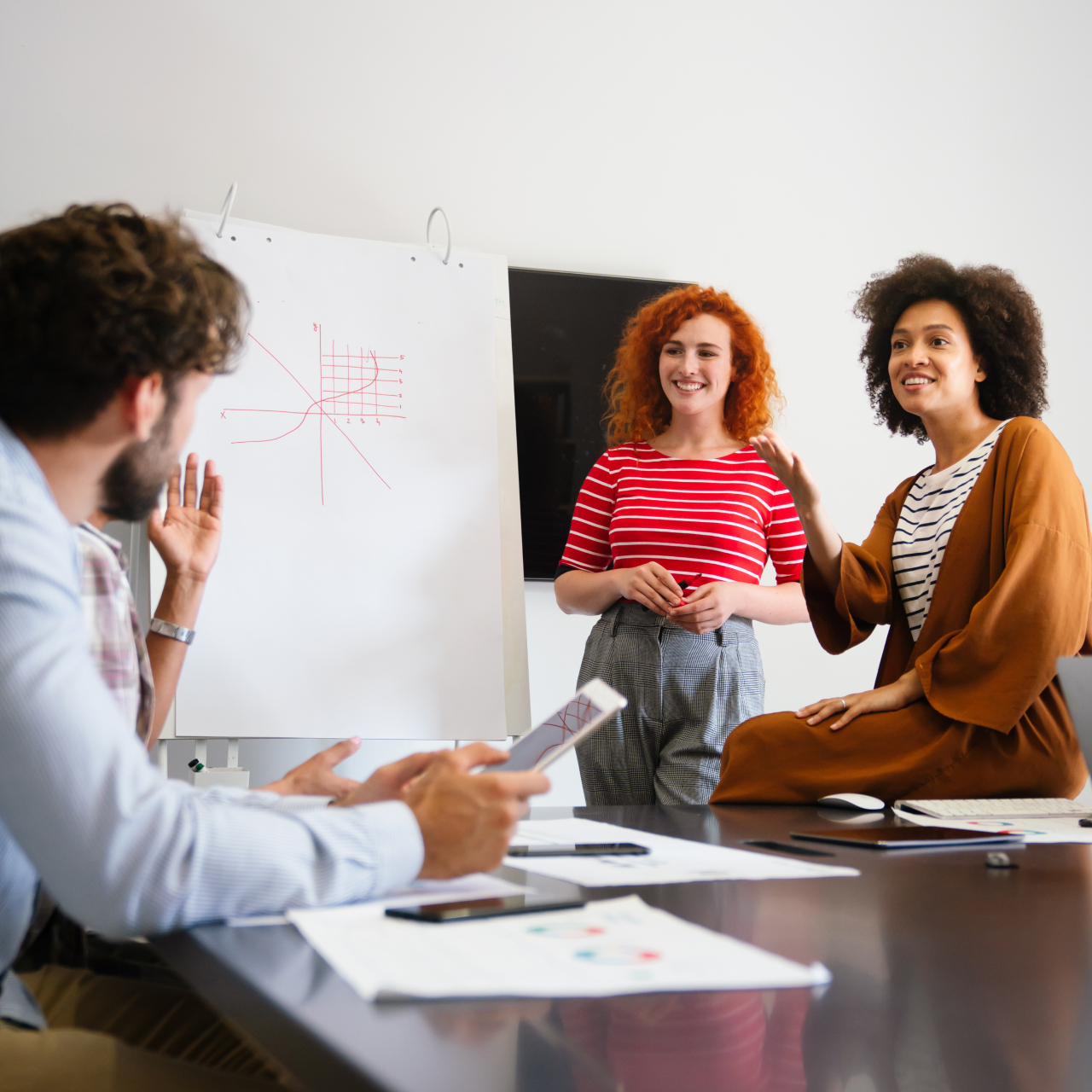 3 people in an informal meeting